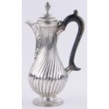 A Victorian silver hot water jug, bulbous swirl design body, London 1878, 12.96 oz, height 21.5cm.