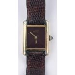 A ladies Cartier quartz wristwatch, silver gilt case with burgundy dial, case width 20 mm,