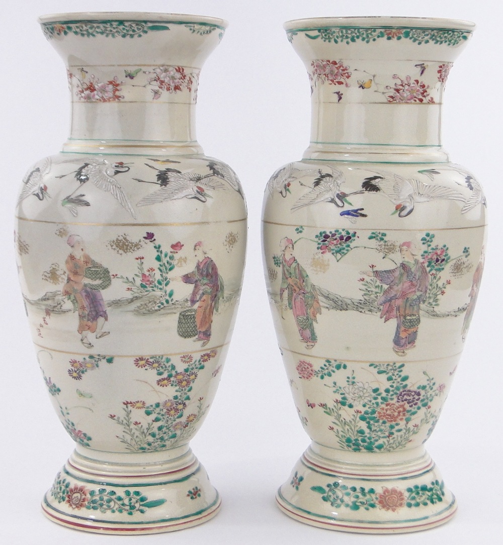 Pair of 19th century Japanese porcelain vases, hand painted designs of figures,