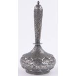 A 19th century Islamic silver narrow necked pot and cover, relief chased floral decoration allover,