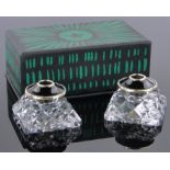 A cased pair of Norwegian silver and black enamel topped cut-glass candlesticks, width 4.5cm.