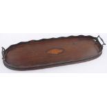 An Edwardian mahogany tea tray, with inlaid shell marquetry and brass handles, length 58cm.