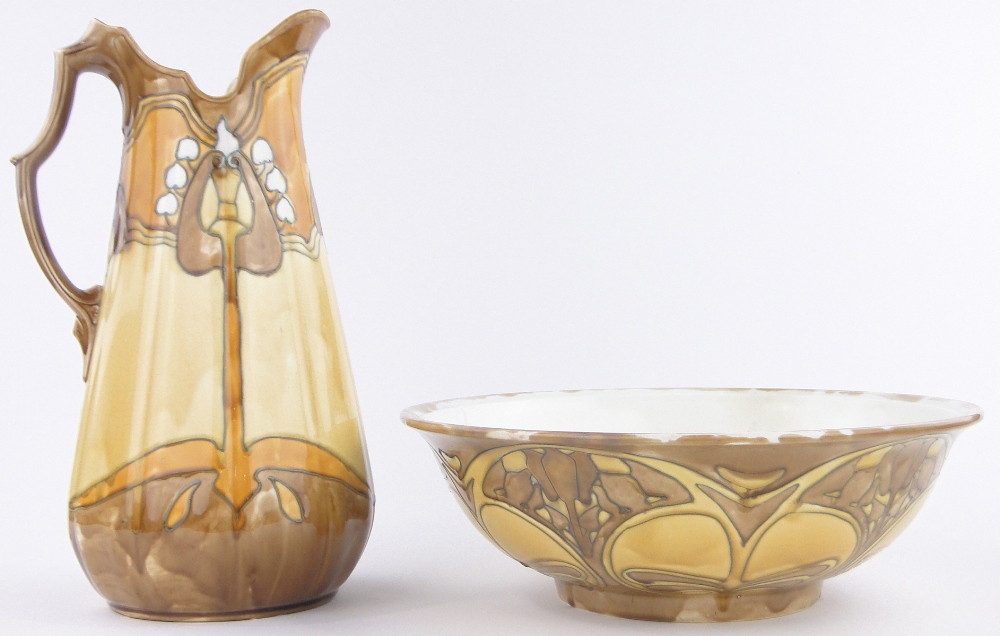 A Minton Secessionist pottery wash jug and basin set, tube-lined stylised Art Nouveau designs,