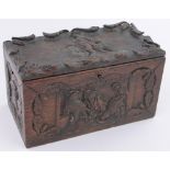 A 19th century rectangular oak box, relief carved with anthropomorphic studies of monkeys and dogs,