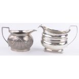 A George III silver cream jug, London 1812 and a Mappin & Webb, half fluted silver cream jug,