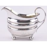 A George III silver cream jug, London 1810, 6.28 oz.