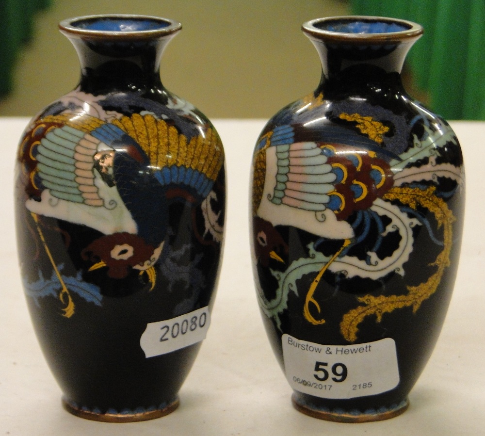 A pair of black ground Cloisonné vases.