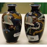 A pair of black ground Cloisonné vases.