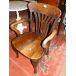 A late Victorian oak desk chair raised on turned cabriole legs.