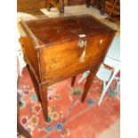 An Antique stained pine cabinet on stand with pierced brass gallery with fall front revealing a