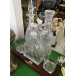 A golfing design bar set and 2 crystal decanters.