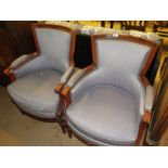 Pair of French upholstered and carved beech framed open armchairs.