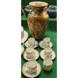 A Satsuma vase with painted and gilded decoration and early Paragon coffee cans and saucers.