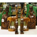 A pair of carved hardwood Eastern figures, pair of Antelopes and a pair of heads.