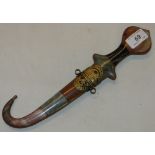 Ornate Eastern dagger with hardstone set handle and sheath and gilt metal mounts.