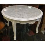 A white circular glass top coffee table.