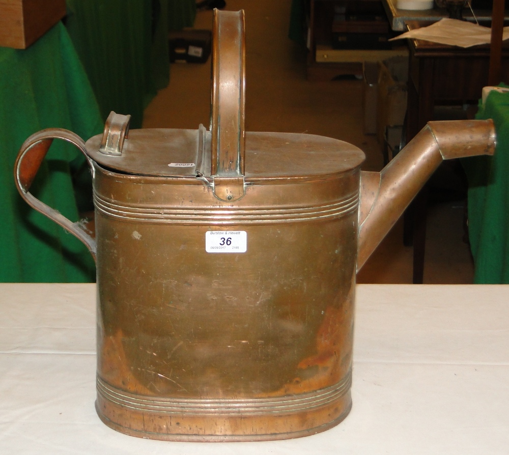 A large Victorian copper hot water can.