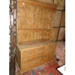 An Antique pine 2-section kitchen dresser, the base fitted with drawers and cupboard.