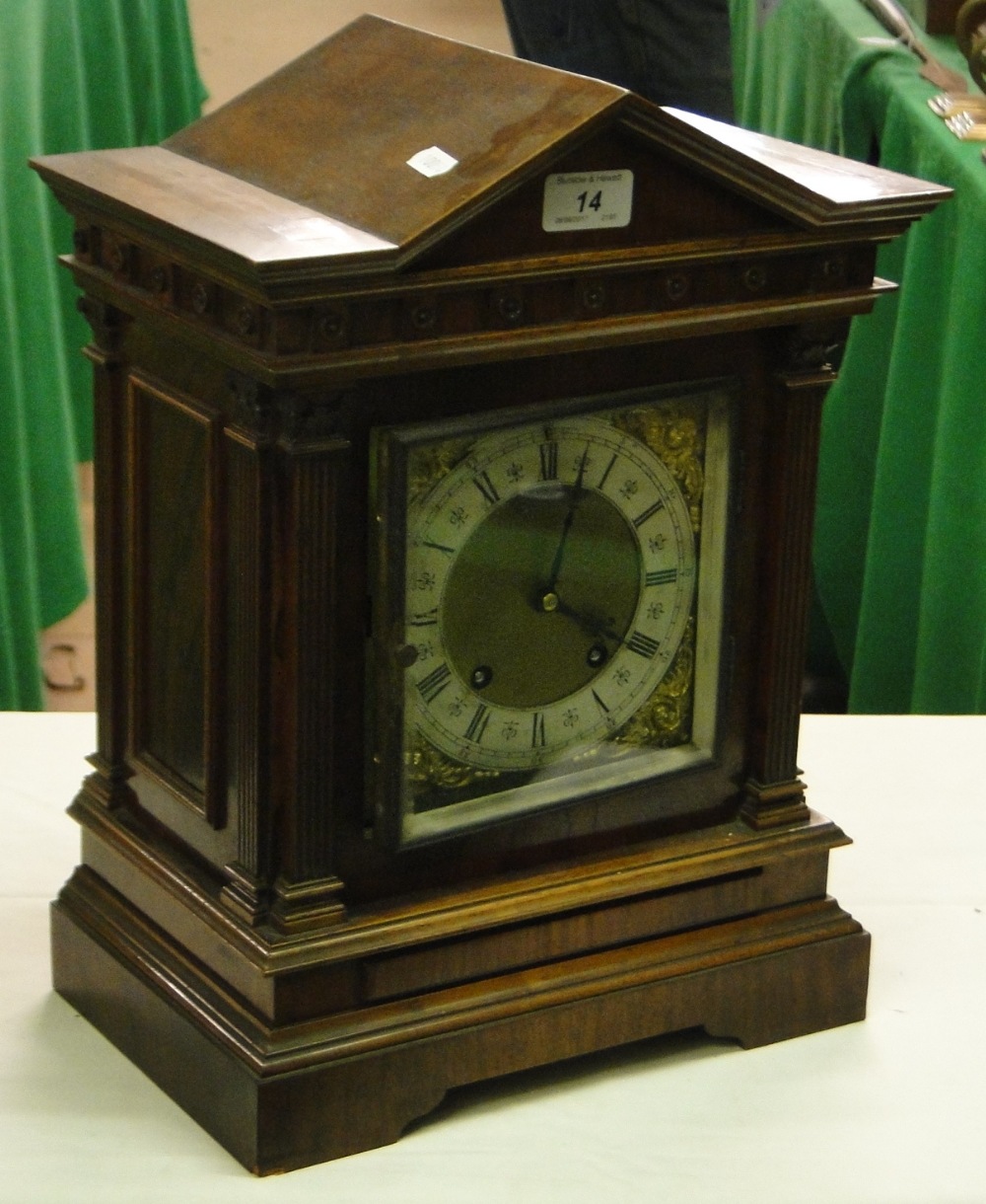 A walnut cased 2-train mantel clock.