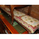 A Victorian upholstered mahogany fender stool.