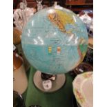 An illuminated globe on stand.