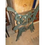 Pair of painted cast-iron bench ends.