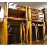 A pair of cherrywood bedside chests.