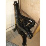 A pair of painted cast-iron bench ends.