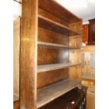 A floor standing oak open bookcase.
