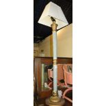 A gilded and marble effect standard lamp and shade.