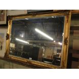 A giltwood bevelled edge wall mirror.