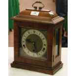 A mahogany cased brass mantel clock with 3-train movement.
