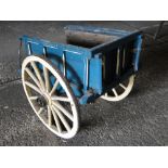 A small Victorian painted pine 2-wheeled cart, height 2'8", length 3'.