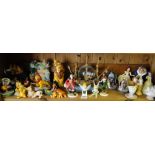 A shelf of Disney Beauty & The Beast, Peter Pan and Lion King Disney figures.