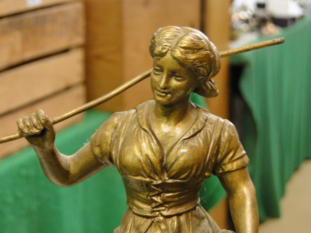 A slate and marble mantel clock surmounted by a gilded spelter figure. - Image 2 of 2