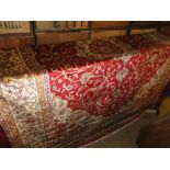 A red ground Kashan carpet, 2.8M x 2M.