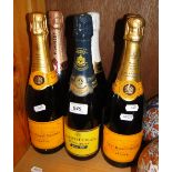 6 Bottles of champagne including Heidsieck and Veuve Clicquot.