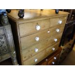 A Victorian pine 5-drawer chest with ceramic handles.