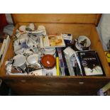 DVDs, coffee grinder, mugs, etc., in pine box.