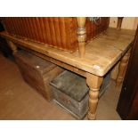 A pine plank top kitchen table with end frieze drawer and turned legs, length 5'.