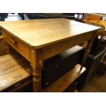 A Vintage pine kitchen table with end frieze drawer on turned legs, length 3'9".