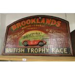 A reproduction large wooden Brooklands motor course sign.