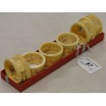 A set of 6 carved and pierced ivory napkin rings.