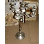 A polished metal 4 branch floor standing candelabra.