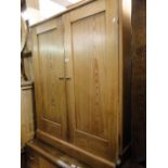 An Antique pine 2-door larder cupboard.