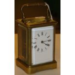 A brass carriage clock.