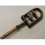 A Vintage shooting stick with silver collar inscribed "E C C".