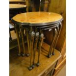 An oval mahogany nest of 3 tables.