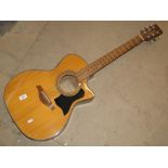 A Tanglewood hand crafted acoustic guitar and case.