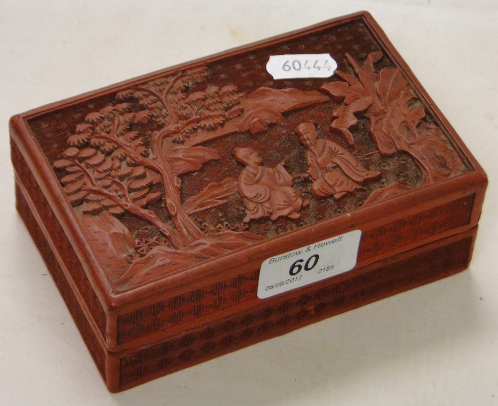 A carved Oriental cinnabar box.